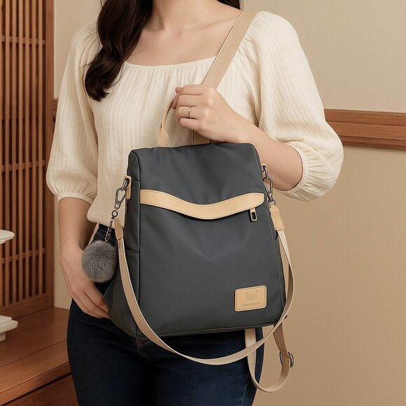 ποΈChic & Versatile Travel Pom-Pom Charm Backpack β Waterproof & Stylish πβ¨ - Picture 3 of 11